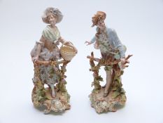 Pair of German ceramic figures of a lady and gentleman,
