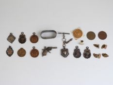 Miniature Italian pistol charm, hallmarked fob, medals, hallmarked silver napkin ring,