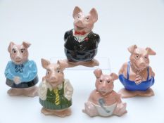 A set of five Nat West pig money boxes