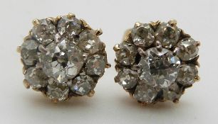 A pair of Victorian earrings set with old cut diamonds in a cluster, in original Jays of London box,
