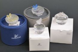 Four Swarovski Crystal cut glass trinket boxes, largest 6cm in diameter,