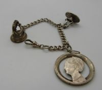 A silver fob chain with two fobs