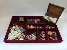 A large tray of costume jewellery including Avon, Monet, Ciro, earrings,