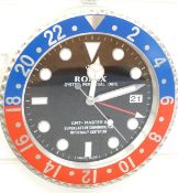 Rolex jewellers' display wall clock, 'Oyster Perpetual Date' to black dial, blue and red steel case,