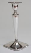 An early 20thC candlestick, marks rubbed,