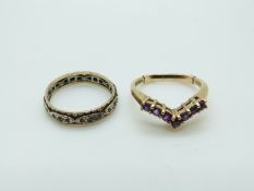 A 9ct gold ring set with amethyst and a 9ct gold and silver eternity ring