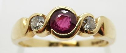 An 18ct gold ring set with a ruby of approximately 0.3ct and two diamonds, size N/O, 4.