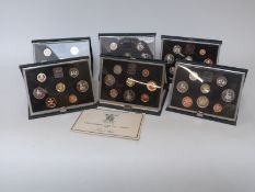 Royal Mint proof coin collections comprising 1983, 1984, 1985, 1986, 1987 and 1988,
