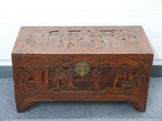 19th / early 20thC carved Eastern coffer with figures in landscapes W88 x D43 x H48cm