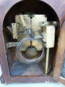 A late 19th / 20thC bracket clock in burr walnut and oak case,