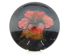 Moorcroft pedestal dish in Hibiscus pattern on a blue ground, diameter 9.