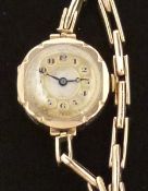 Ladies 9ct gold wristwatch with blued Breguet hands, black Arabic numerals,