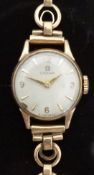 Omega 9ct gold ladies wristwatch with gold hands, Arabic numerals, baton markers,