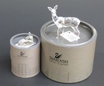 Two Swarovski Crystal cut glass deer, largest 10cm tall,
