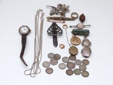 A silver football fob, silver watch, Victorian pieces, carved Chinese nut, Victorian clip,