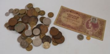 A quantity of UK and overseas coinage together with an unresearched gold coloured example,