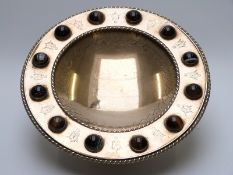 A 19thC gilt metal tazza set with twelve banded agate cabochons,