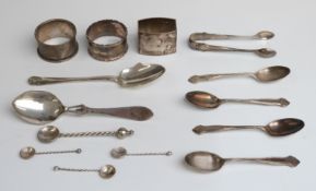 Three hallmarked silver napkin rings, six hallmarked silver spoon and a pair of sugar tongs,