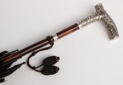 Victorian parasol with hallmarked silver repousse decorated handle (marks rubbed except London)