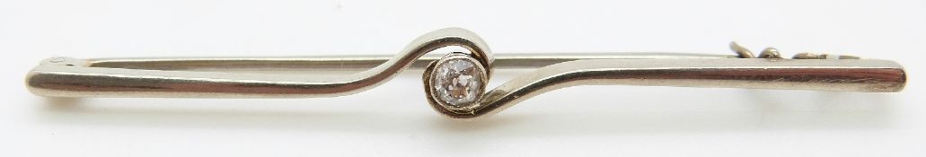 A white metal brooch set with an old cut diamond of approximately 0.15ct, L6.