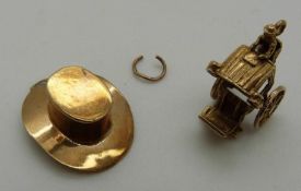 A 9ct gold charm / pendant in the form of a hat and a yellow metal cart, 5.