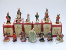 Nine Royal Doulton Bunnykins figures comprising Fortune Teller, Fisherman, Sheriff of Nottingham,