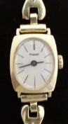 Exquisit 14ct gold ladies wristwatch with black hands and baton markers and silver face,
