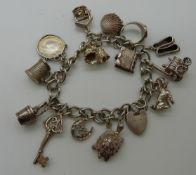 A silver charm bracelet and a silver necklace