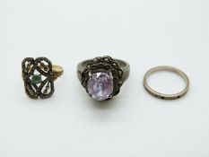 A yellow metal and silver ring set with marcasite and a zircon,