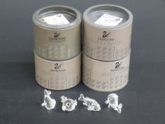 Four Swarovski Crystal cut glass figure groups Fish, in original boxes,