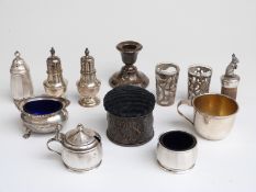 Walker & Hall three piece cruet set, pair of hallmarked silver peppers,