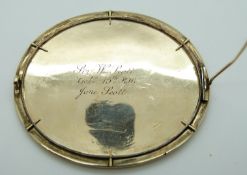 A miniature portrait brooch hand painted with an Indian dancing scene,