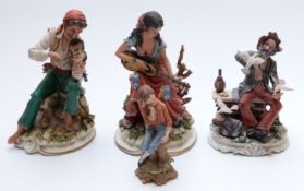 Four Capodimonte figures including two signed examples of gypsy musicians,