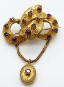 Victorian brooch set with foiled paste in a knot design, 4cm x 2.