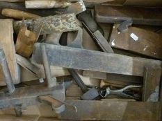 A quantity of vintage woodworking tools including planes,