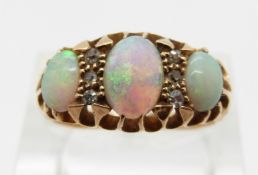 Edwardian 18ct gold ring set with three opal cabochon and six diamonds, Chester 1908,