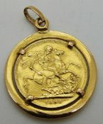 An 1898 gold full sovereign in a yellow metal mount, 11.
