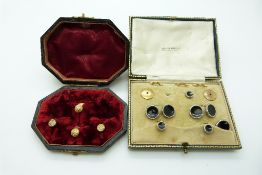 Two sets of studs in original boxes