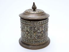 A 19thC brass tobacco jar with lead tamper, mark possibly for Adolf Frankau and Co to base,