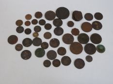 An interesting collection of copper coins to include 18th century tokens, George II halfpennies,