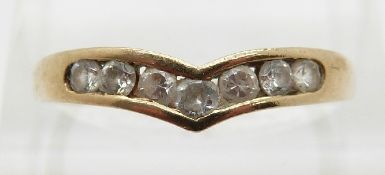 A 9ct gold ring set with a cubic zirconia in a V,