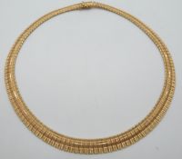 An 18ct gold necklace of graduated rectangular textured links, 38.