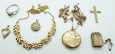 A 9ct gold back and front locket, a 9ct gold chain, 3.5g, charms and a 9ct gold cross, 0.