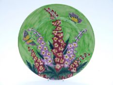 Maling plate decorated with delphiniums and butterflies,