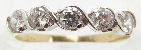 A 14ct gold ring set with five cubic zirconia,