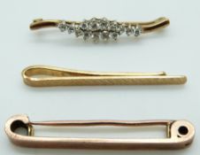 A 9ct rose gold brooch, 9ct gold brooch set with cubic zirconia and a 9ct gold tie clip, 9.