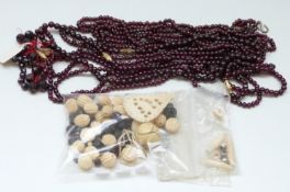 A collection of garnet and bone beads