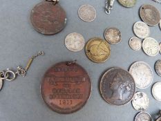 A small collection of silver coins,