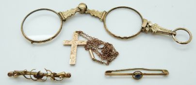 A 9ct rose gold cross, 9ct gold chain and two 9ct gold brooches, 5.
