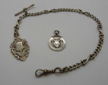 A hallmarked silver watch chain / Albert and two silver fobs